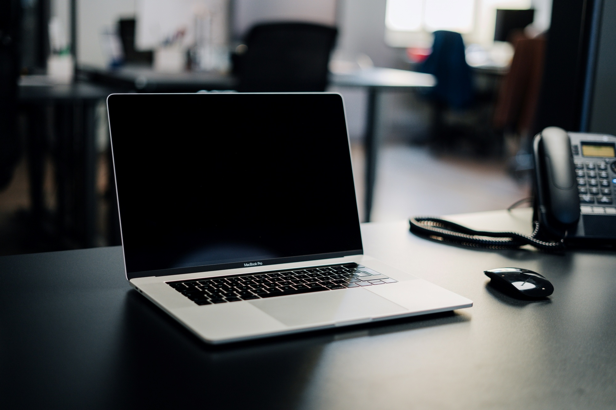 Laptop and phone on desk