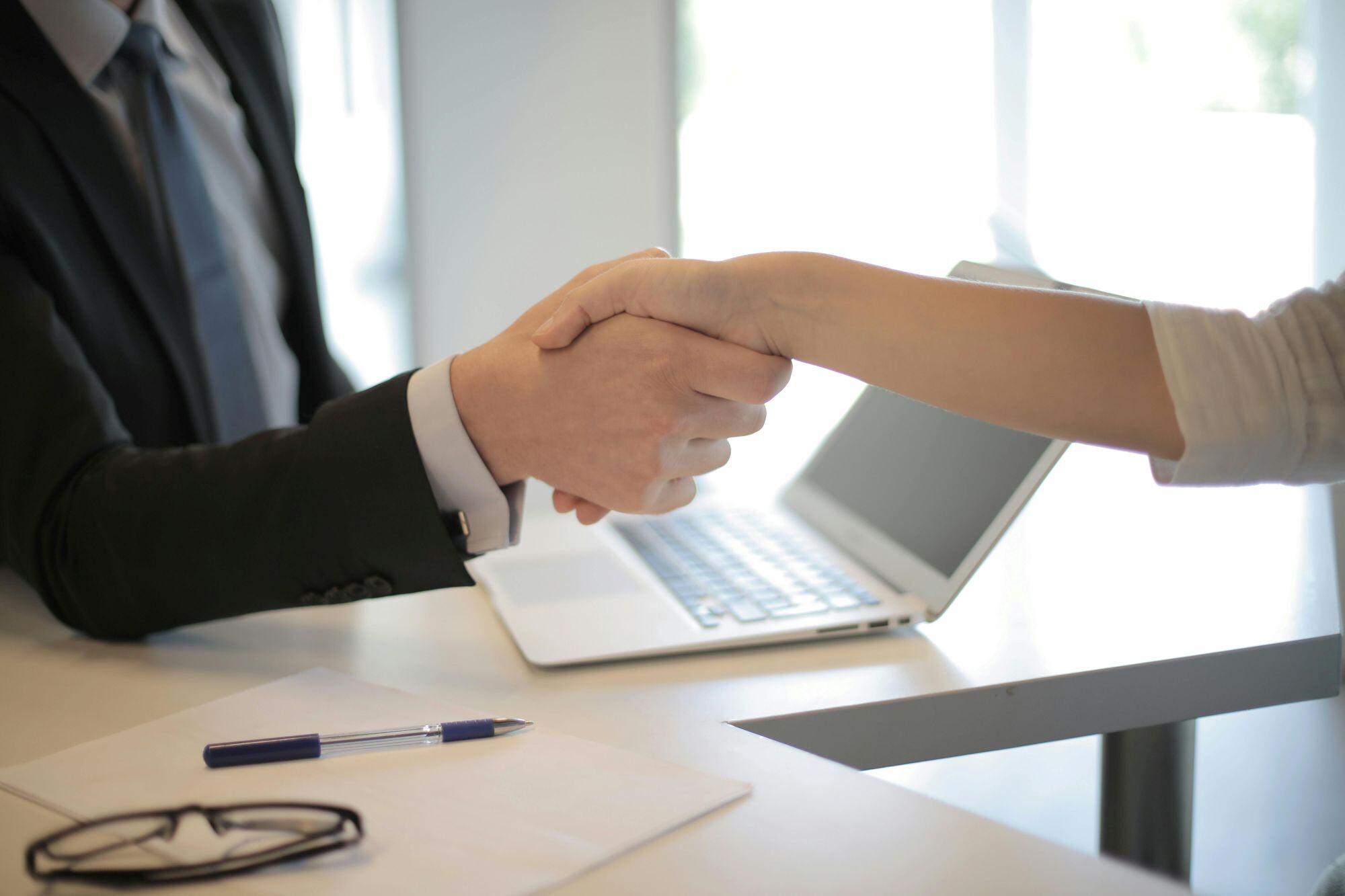 hiring onboarding shaking hands