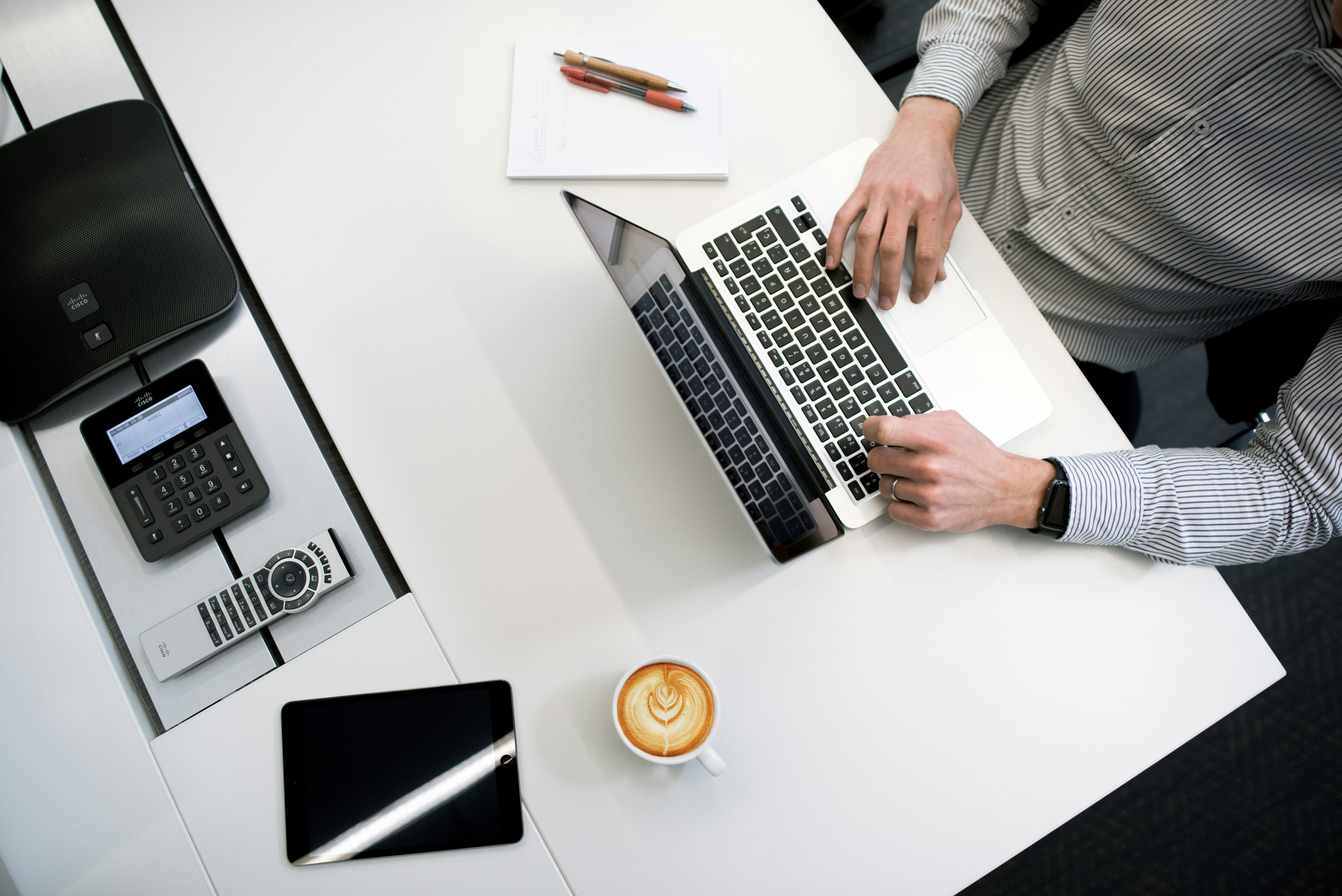 man working at laptop at table